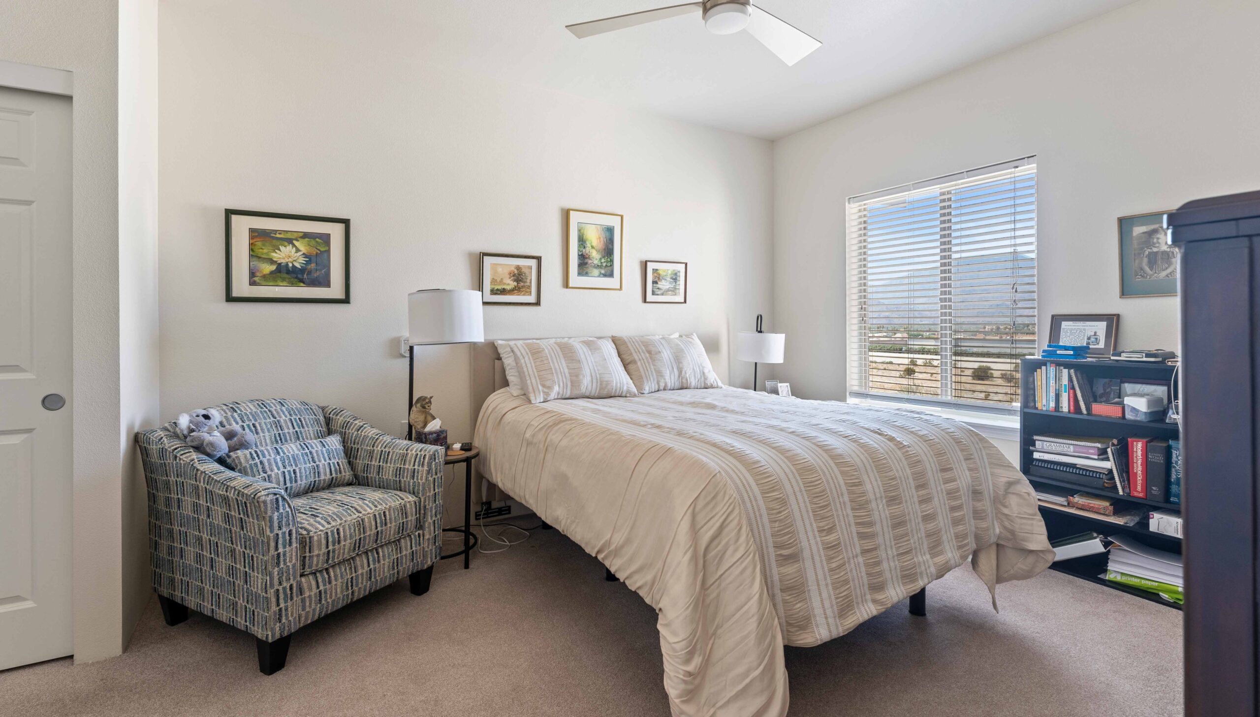 A furnished bedroom in a The Palms at La Quinta apartment